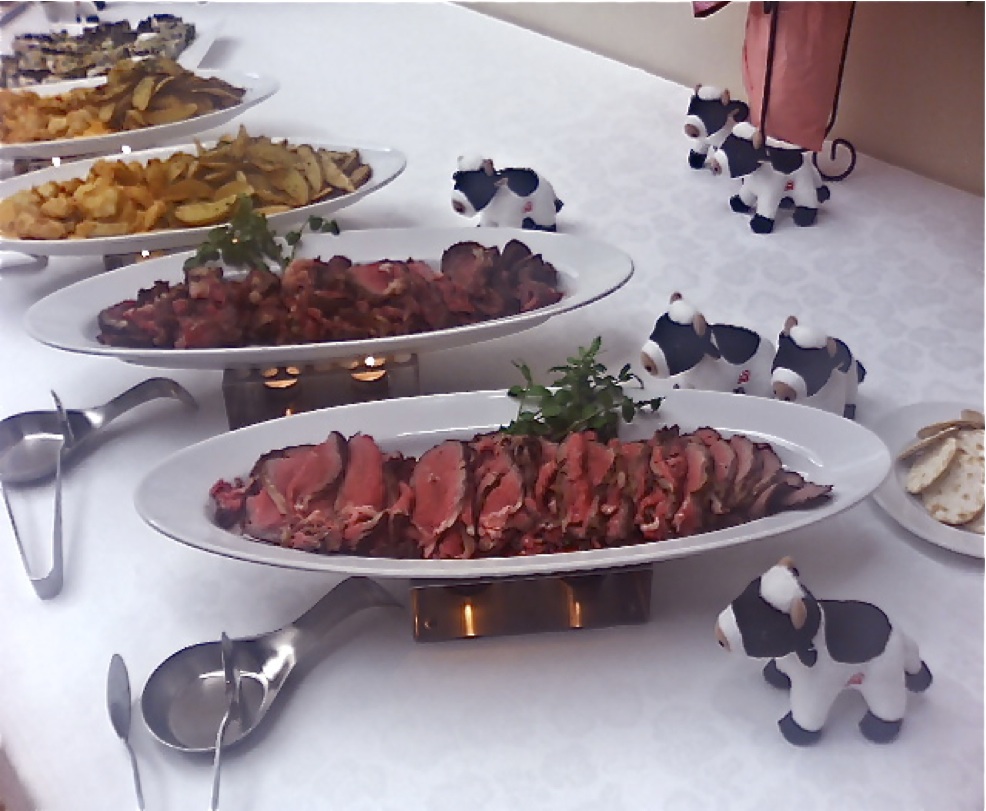 An elegant catering platter with a sunflower centerpiece
